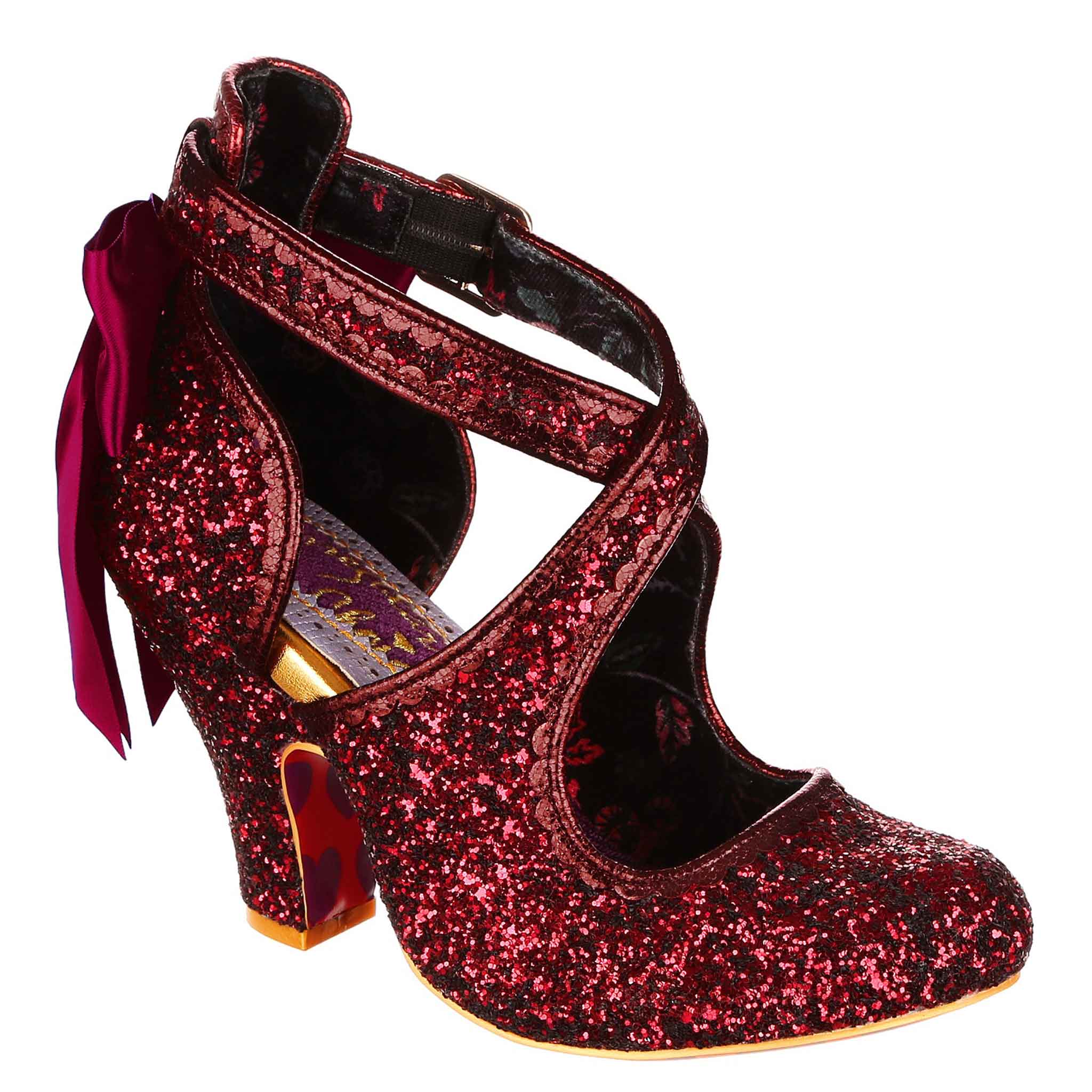 Red glittery high-heeled shoe with a bow at the back and cross over straps on a white background