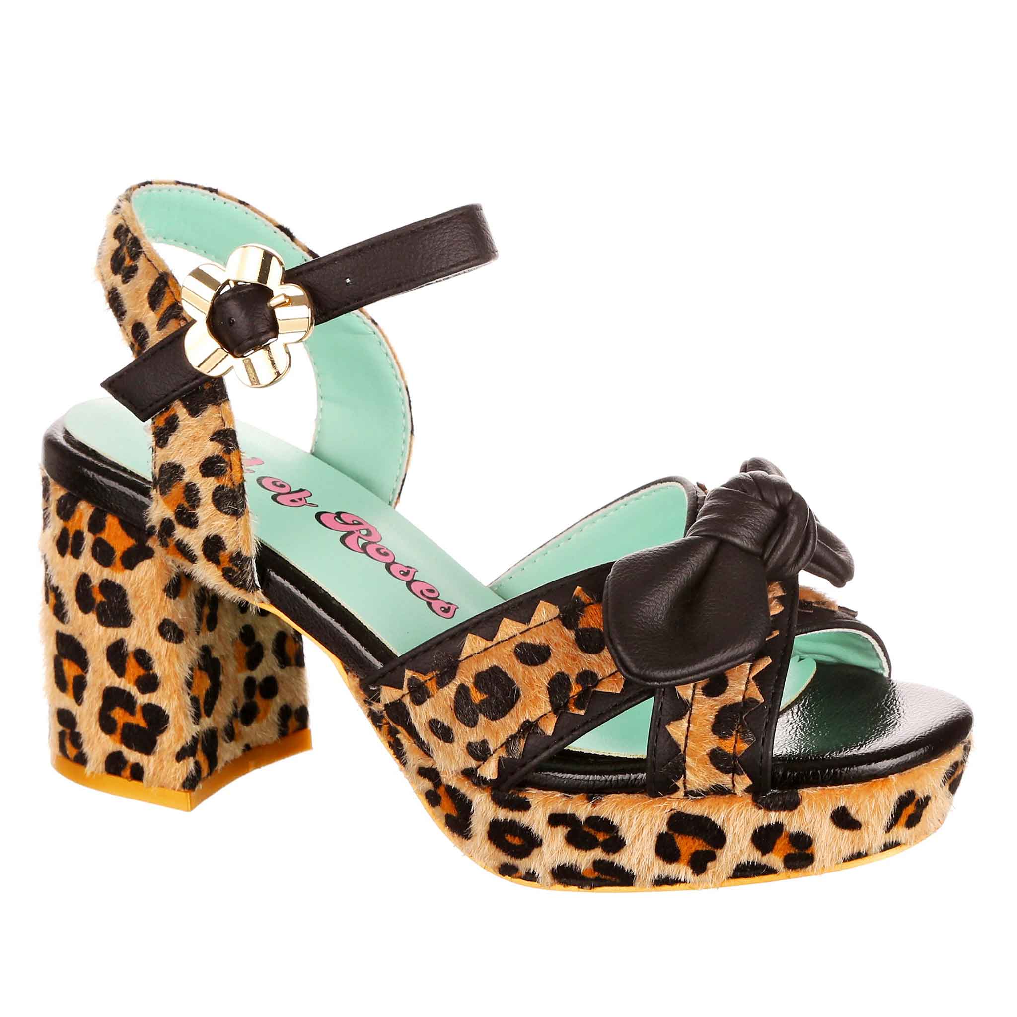 Leopard print strappy open toe sandal with a black tie bow at the toe and block heel and platform sole on a white background.