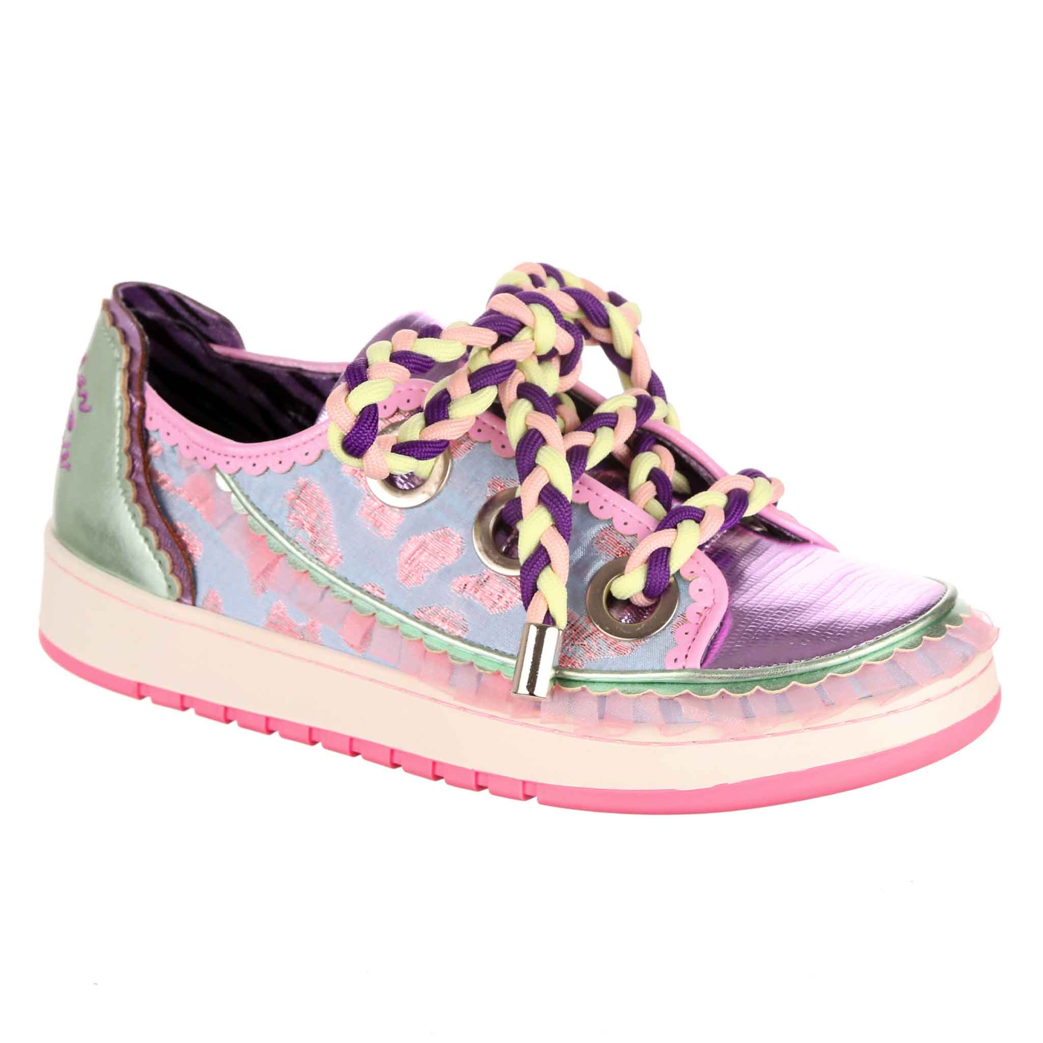 A trainer with a pink and black rubber outsole, and an upper in textured leopard print fabrics in pink and blue with an organza frill around the side. It is laced with chunky plaited laces.