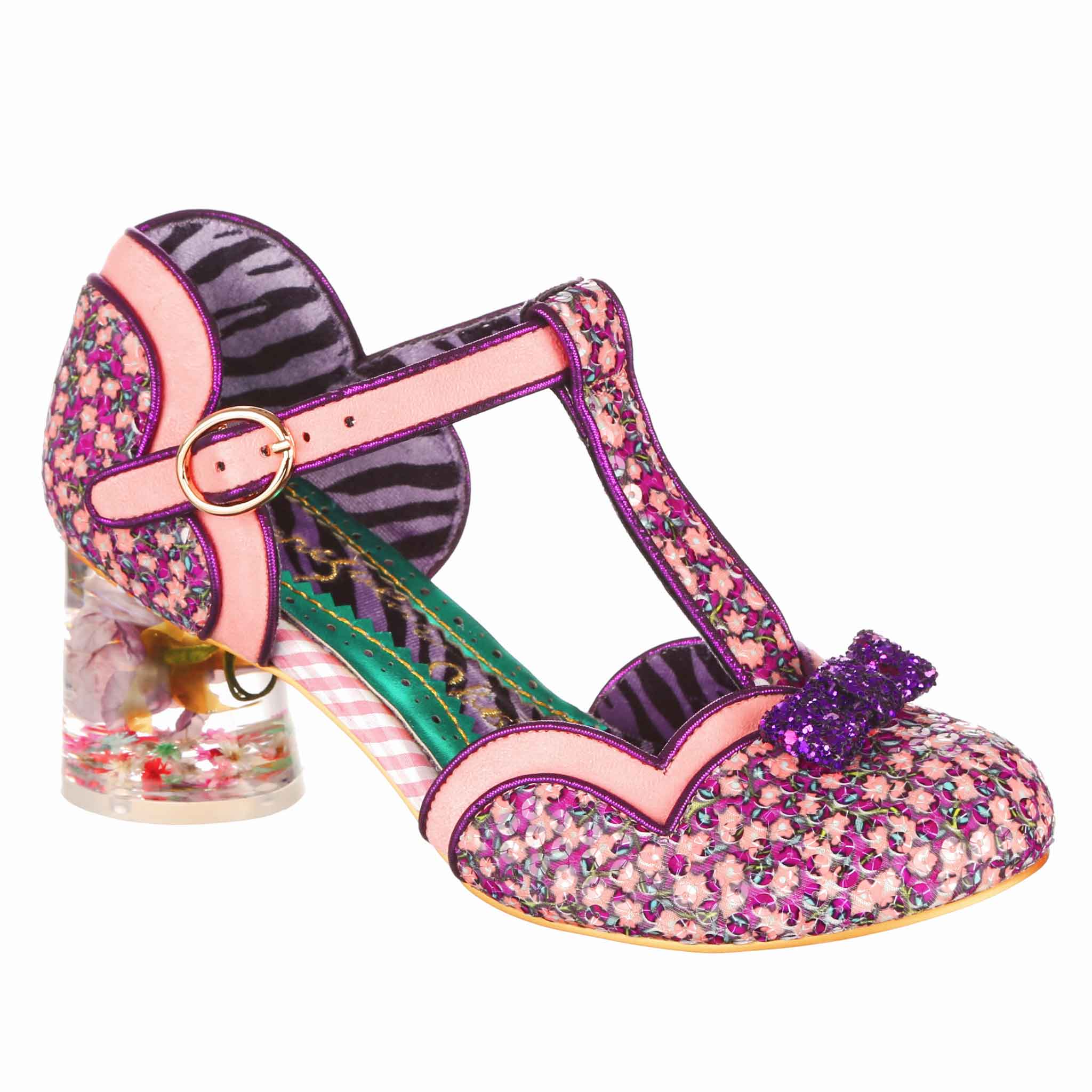 Pink  and purple floral closed toe T-bar shoe with a buckle fastening and pink and purple scalloped edging. The shoe has a clear resin heel with a flower set inside and a mini purple glitter bow on the toe of the shoe, the shoe is a side angle shot with white background.
