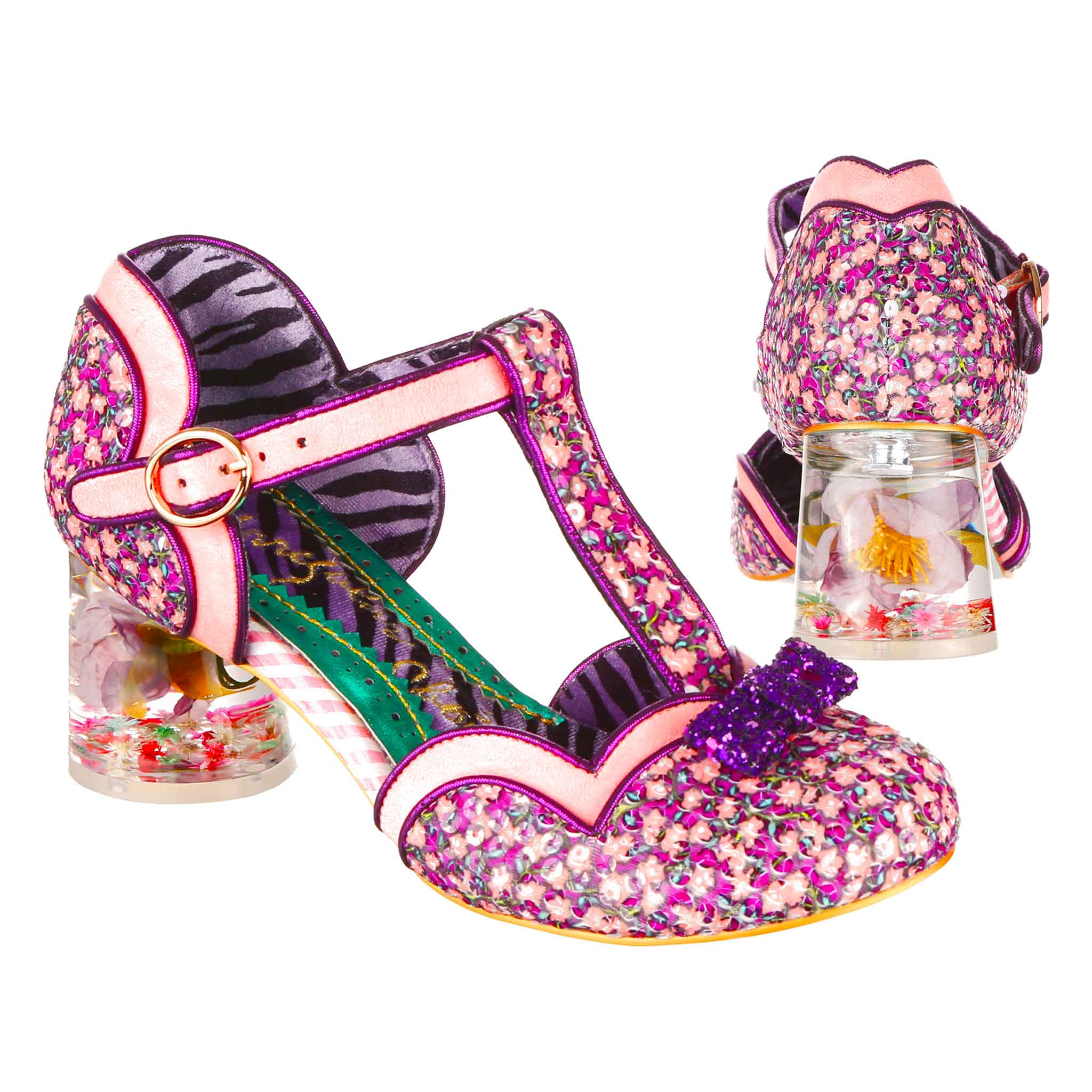 Pink  and purple floral closed toe T-bar shoe with a buckle fastening and pink and purple scalloped edging. The shoe has a clear resin heel with a flower set inside and a mini purple glitter bow on the toe of the shoe, the shoe is a side angle shot with white background.